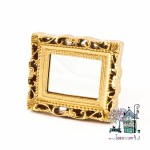 Miniaturowe lustro w złotej ramie