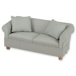 Miniaturowa sofa w groszki