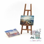 Miniaturowa sztaluga z obrazami